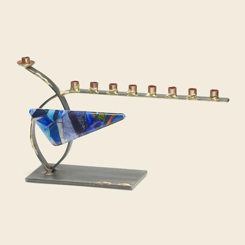 Small curved steel menorah with glass triangle